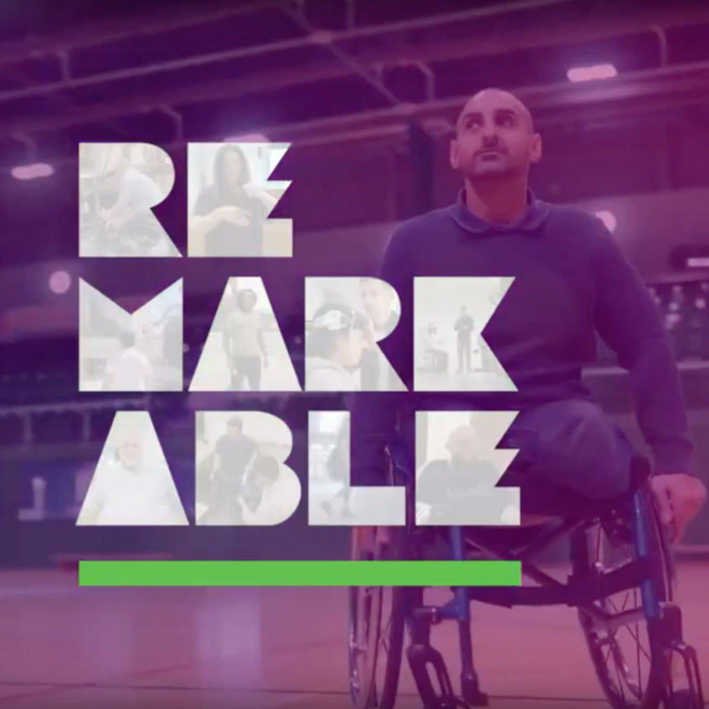 a photo of a man in a wheelchair with the logo for Remarkable.